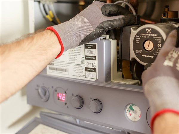 Gas Safe engineer carrying out a landlord gas safety check on a boiler in Brentwood